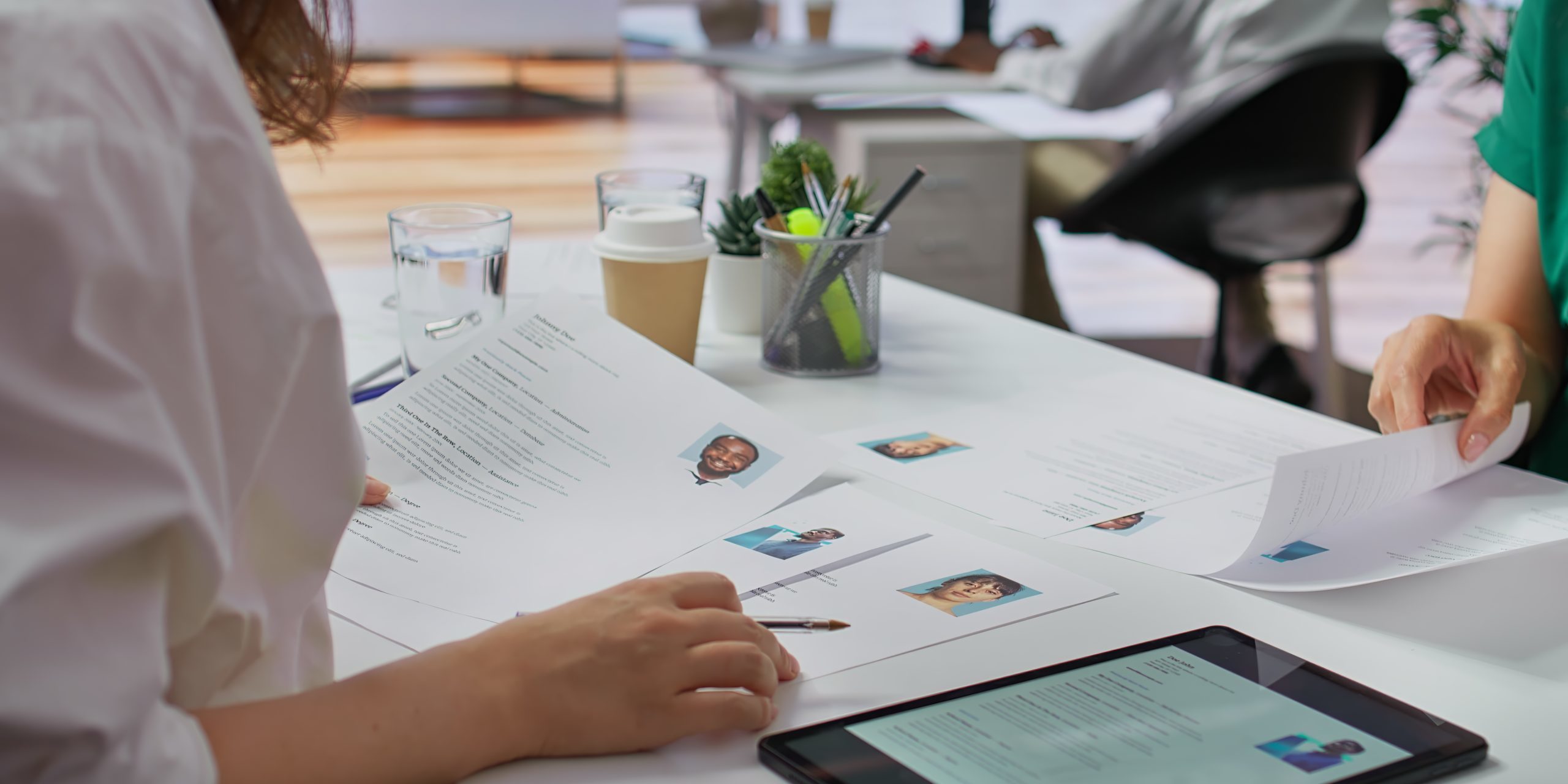Team of recruiters selecting candidates based on their resumes